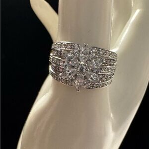 Sterling Silver Floral Diamonique Ring w/CZ stones surrounding a Floral Center